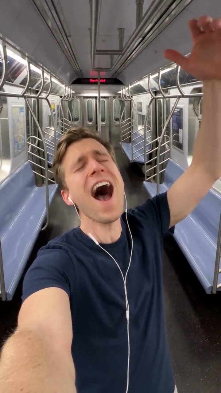 MakeViral reference still of a man singing on a subway